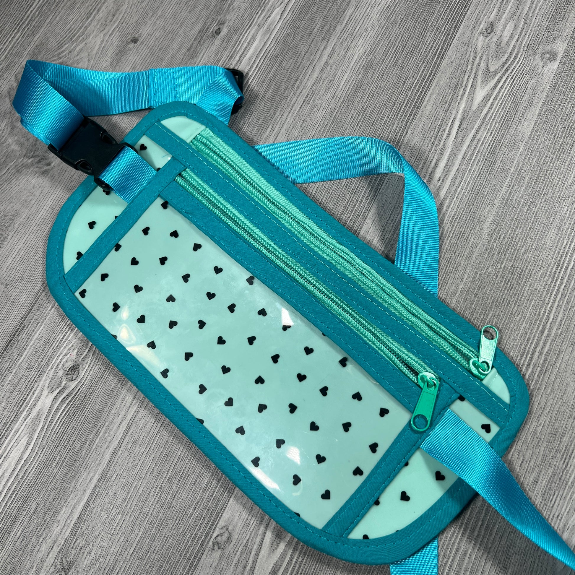 Turquoise jelly vinyl with black hearts travel belt 